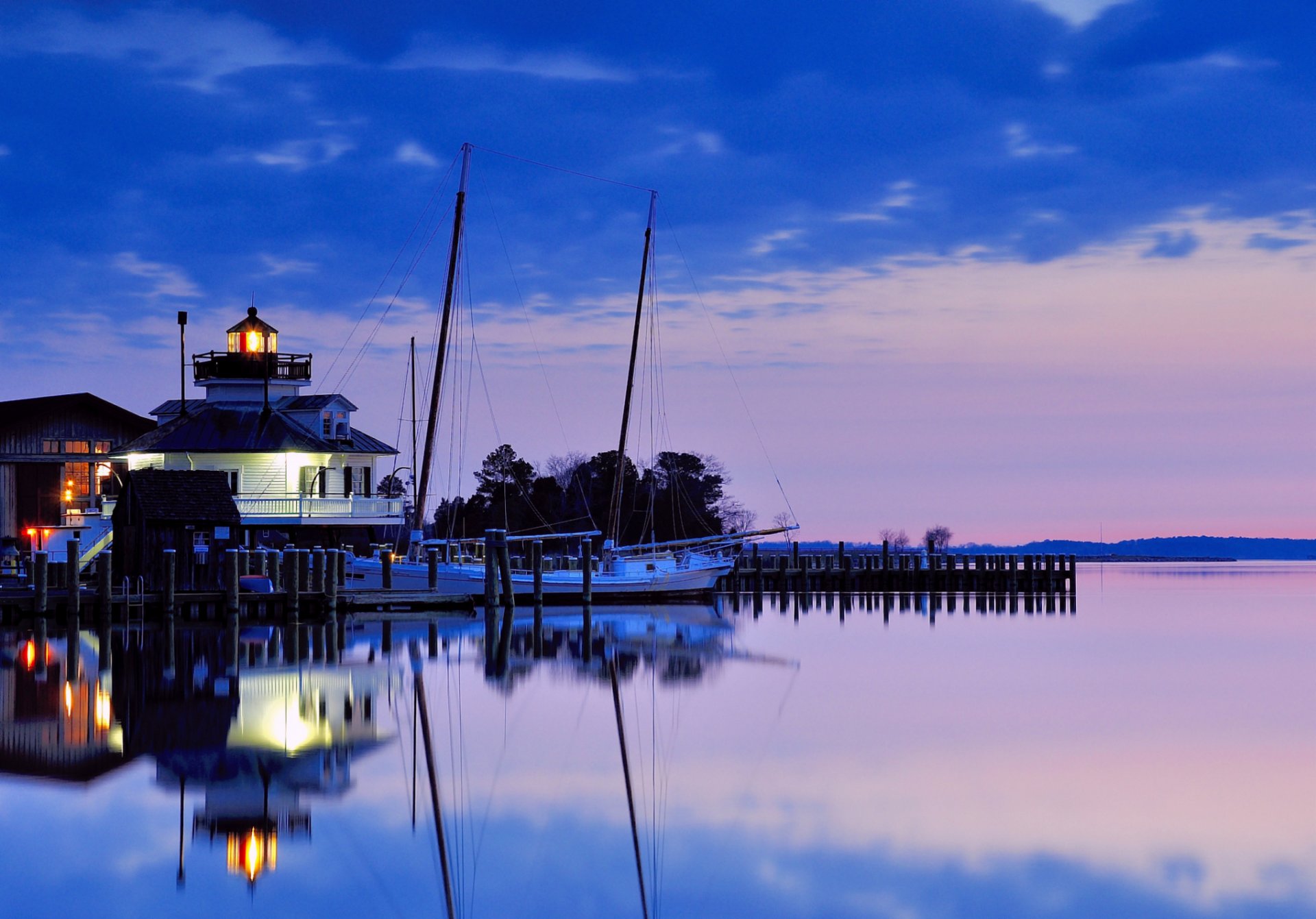 united states maryland lighthouse night sunset blue lilac sky clouds water gulf reflection