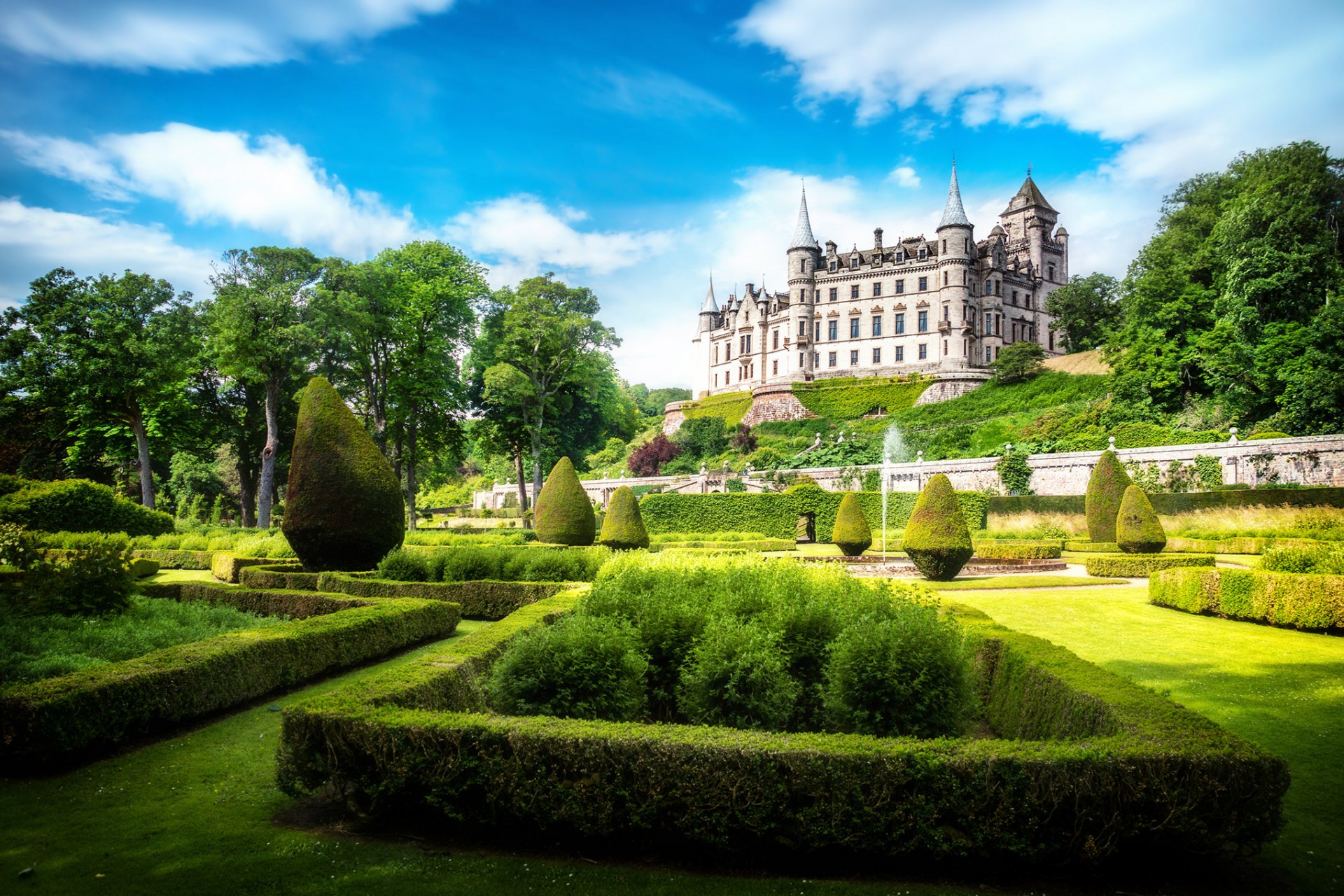 dunrobin castle sutherland scotland alba uk castle park sun light sky clouds greenery grass lawn bushes trees fountain nature landscape