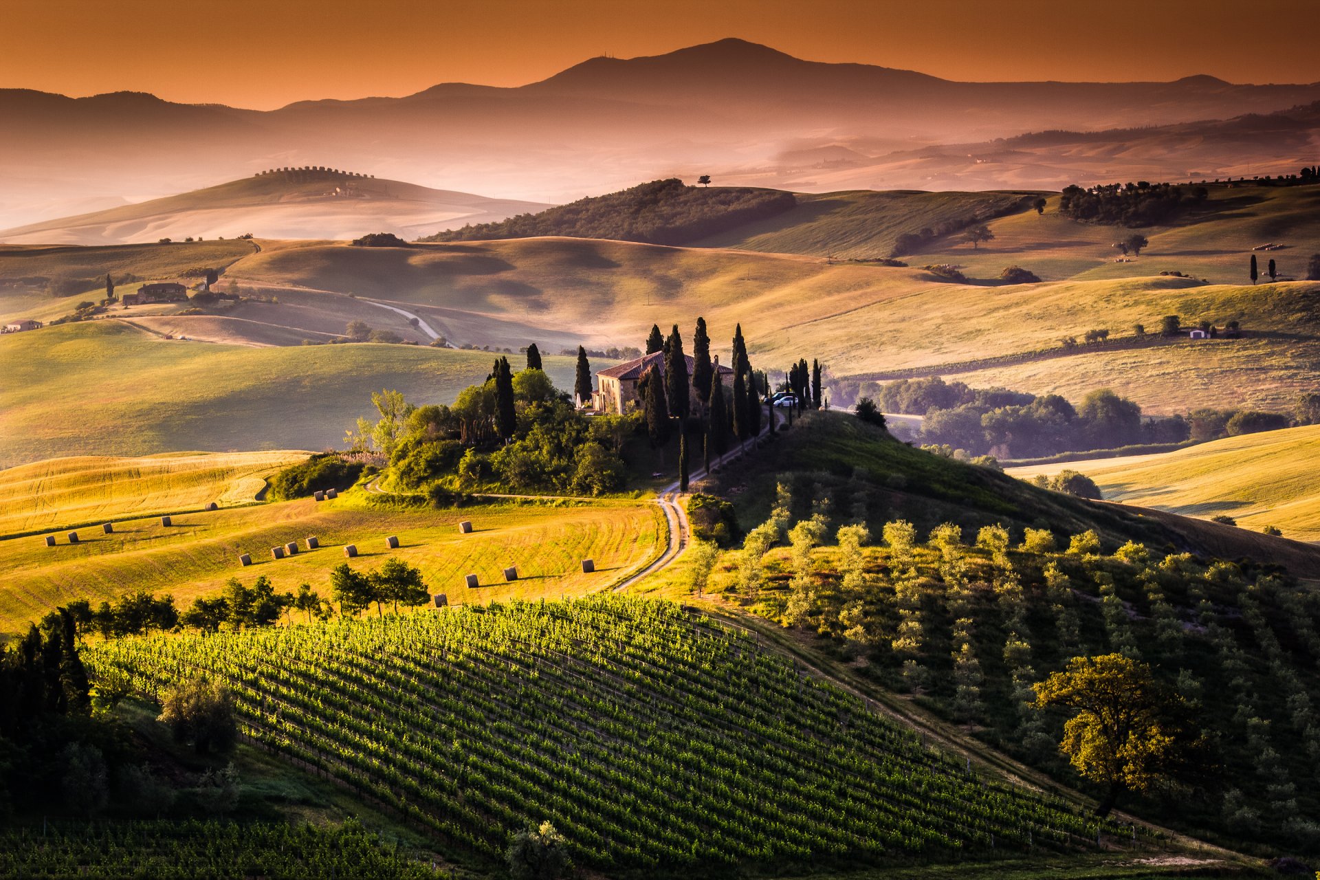 tuscany italy landscape nature fields haystacks hay trees hills farms sun sunrise morning