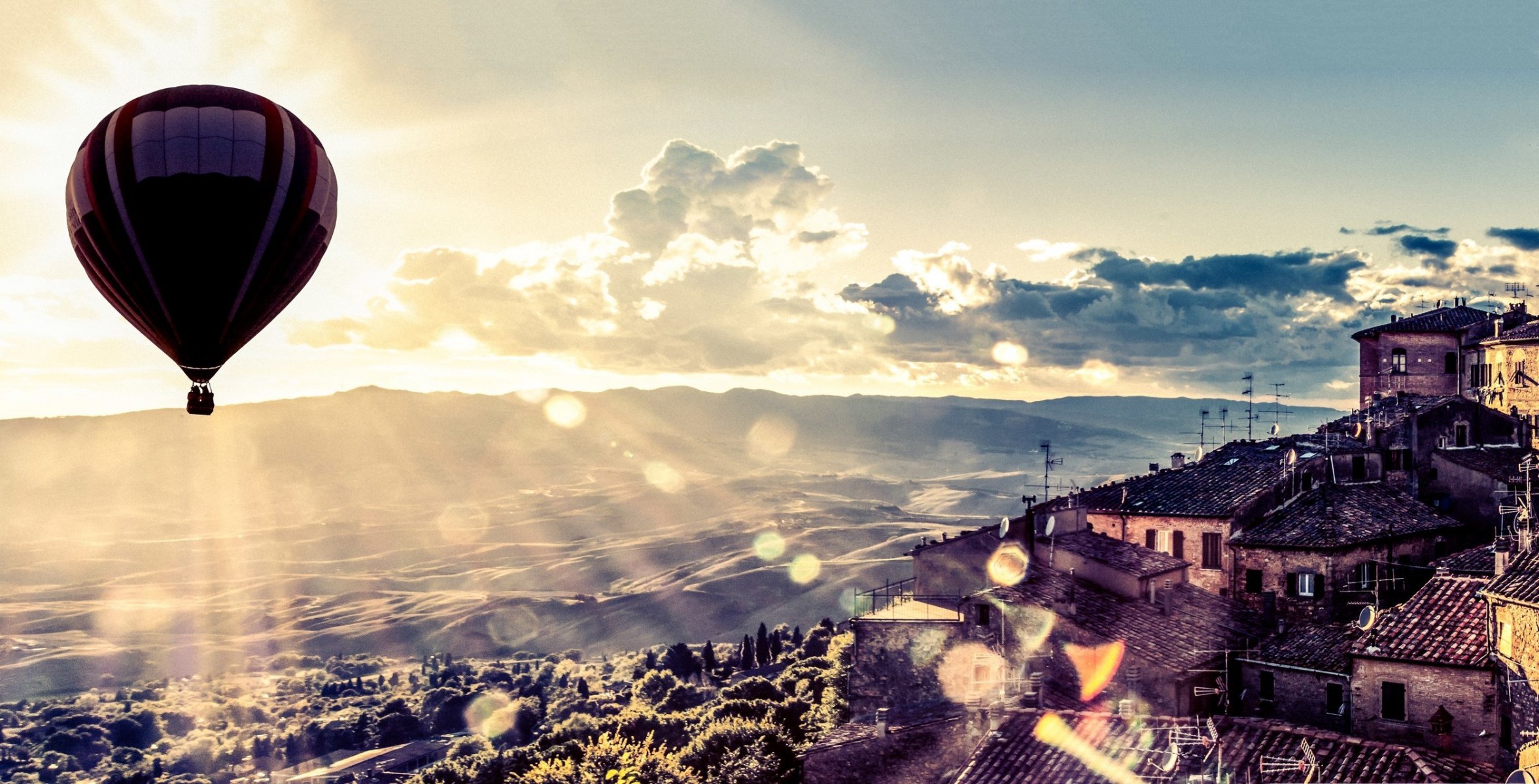 landscape city balloon houses nature trees tree foliage leaves leaves mountains sun glare rays hills beautiful view clouds sky wallpaper widescreen fullscreen widescreen