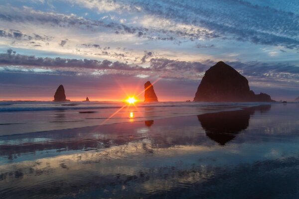 Sunset on the background of a haystack