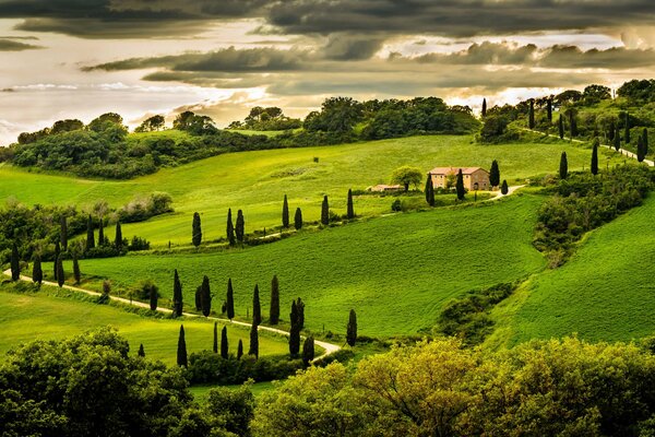 A house among the hills, surrounded by greenery