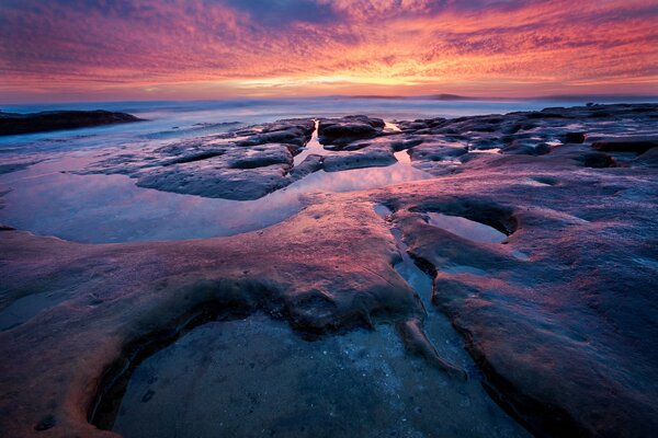 Sunset on the rocky seashore