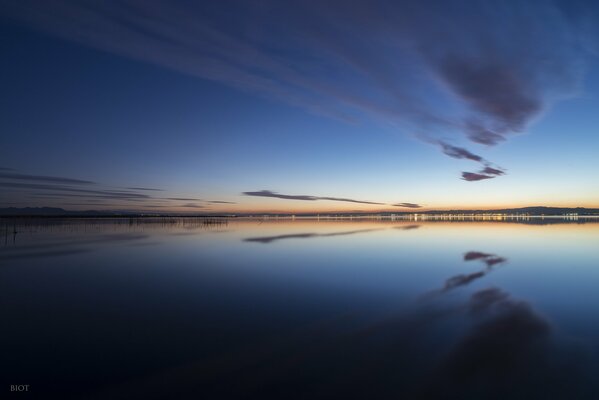 Gray clouds are reflected in the sea