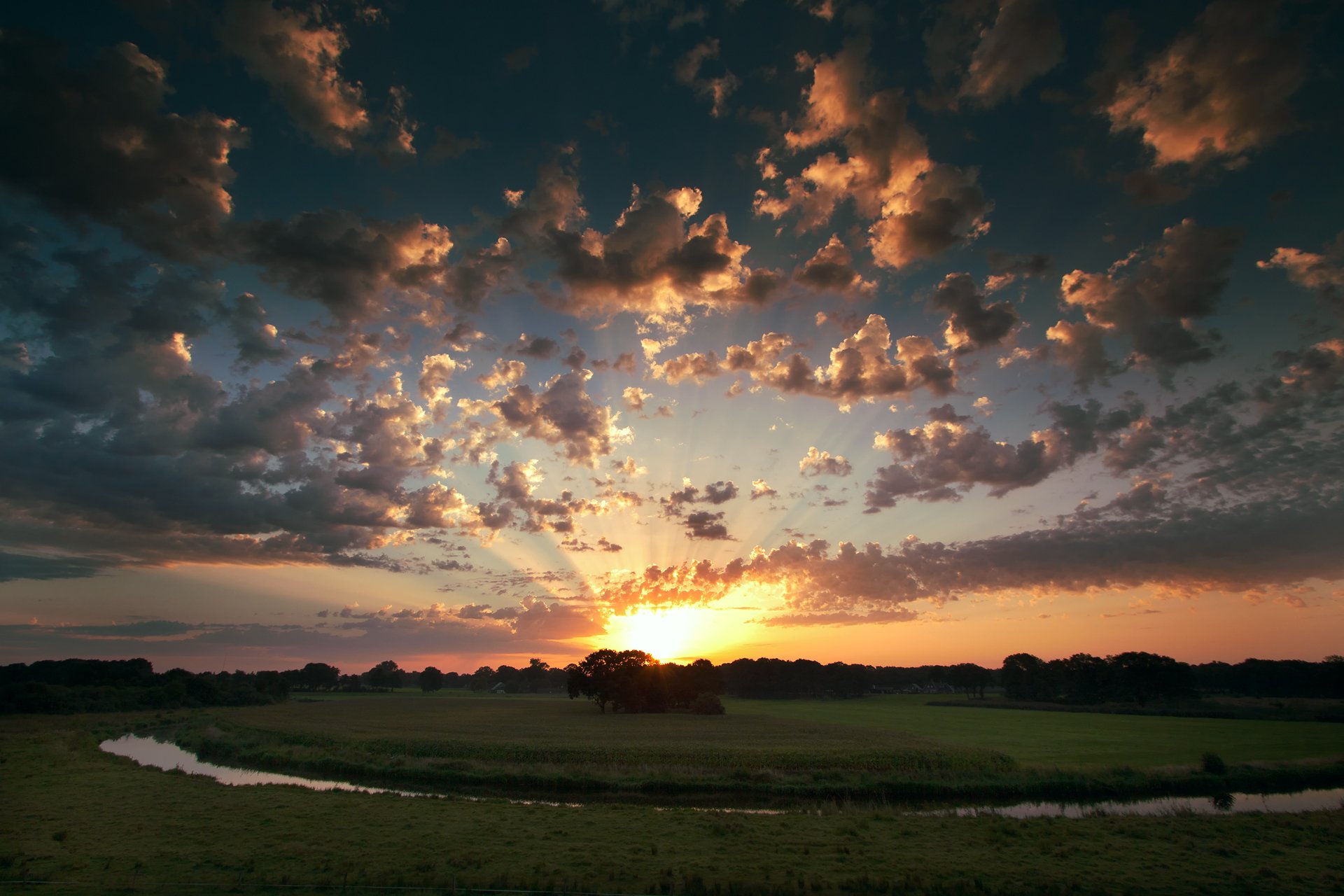 unset sky clouds sun tree the field river