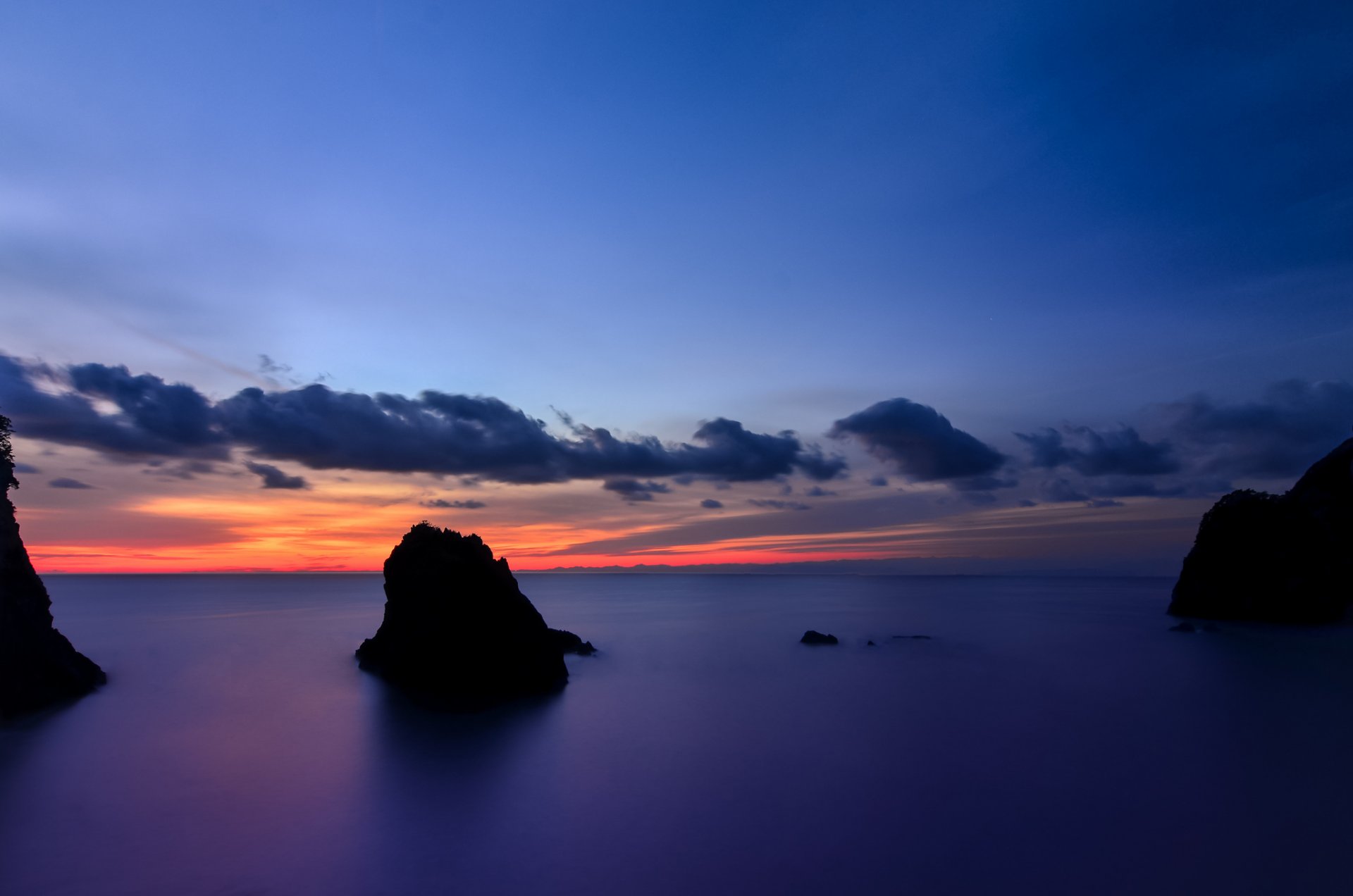 japan shizuoka prefecture island beach rock ocean calm night orange sunset blue sky cloud