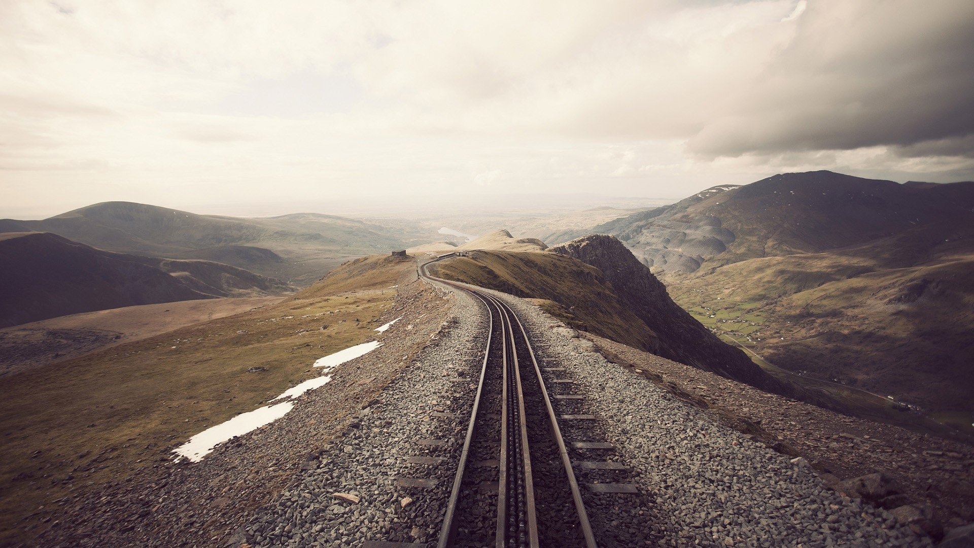 railroad rails heath fill hills clouds rain snow