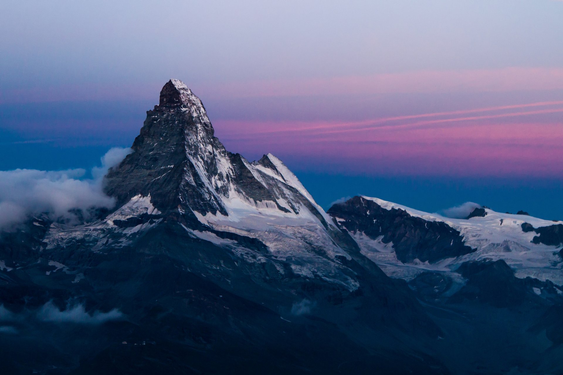 mountains mountain peak slope rocks snow clouds sky