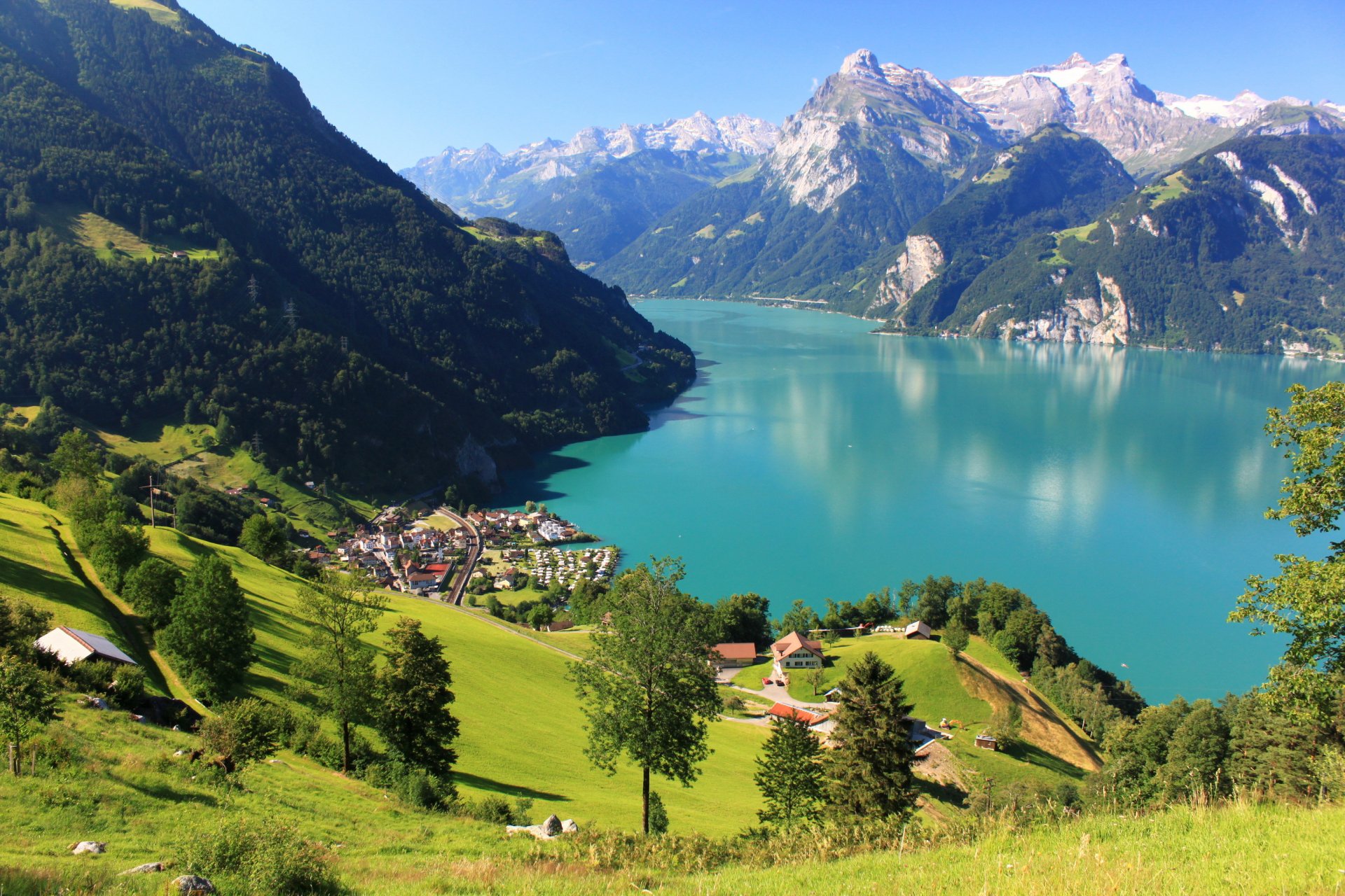 landscape switzerland shwyz mountains rocks snow lake forest town houses