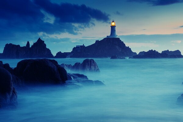 Lighthouse on the rocks of the natural world