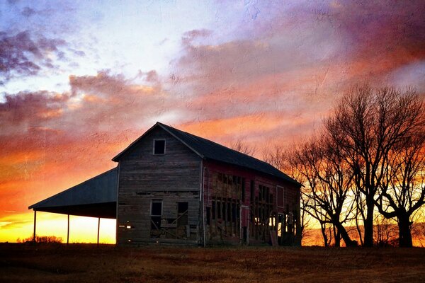 A lonely abandoned house at sunset