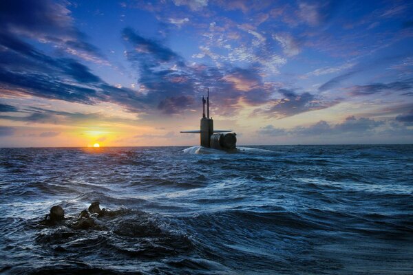 Sunset on the sea. View of the submarine