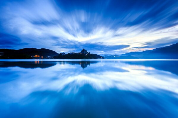 Cloudy sky is reflected in the water