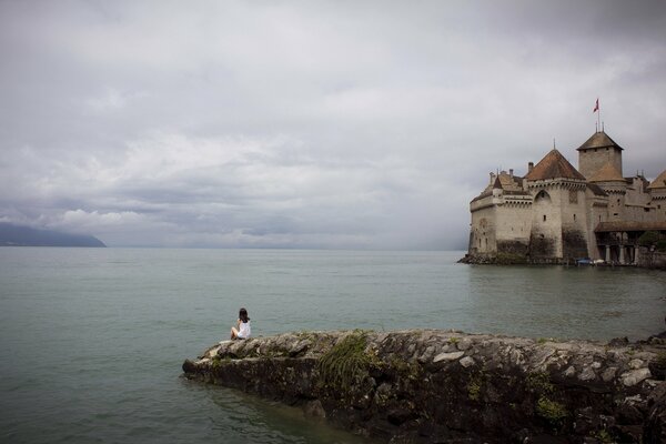 The girl on the stone near the castle