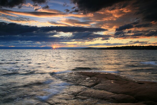 Sunset on the quiet sea coast