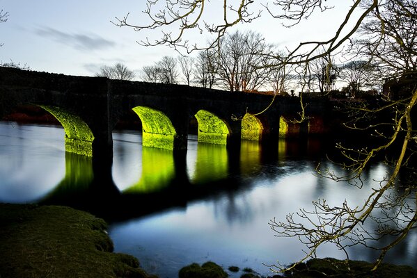 Bright illumination of arches under the bridge