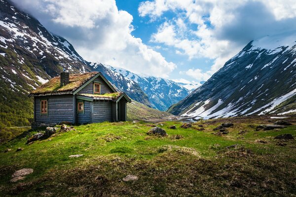 A hut at the foot of a mountain in Norway