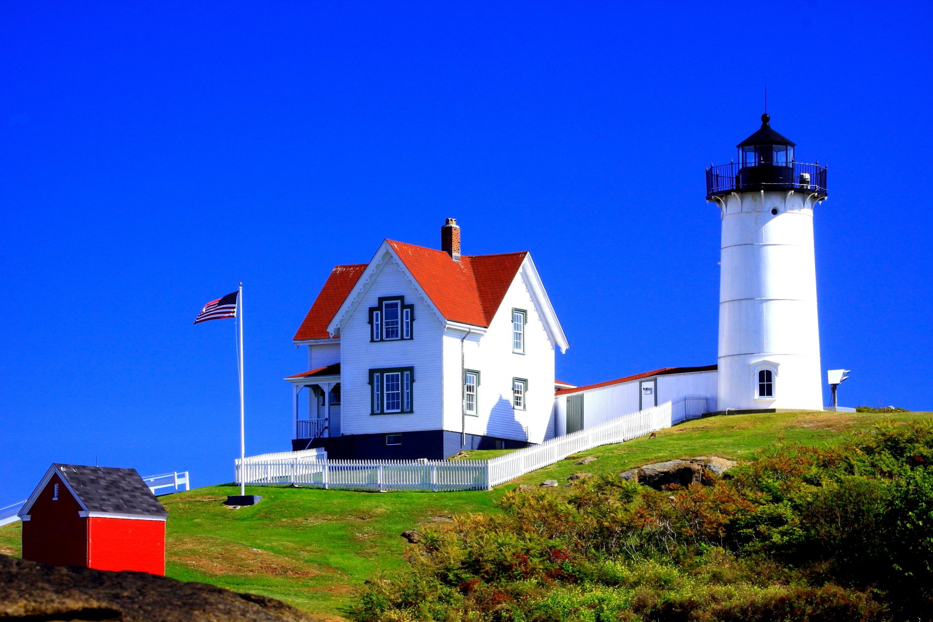 estados unidos faro cabaña bandera