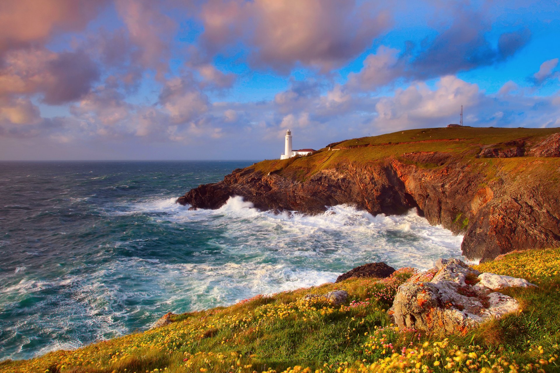 ky clouds rock lighthouse ocean waves beach