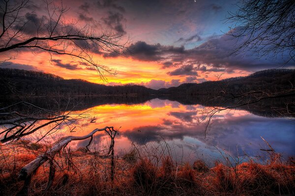 Fiery sunset, reflection in the lake