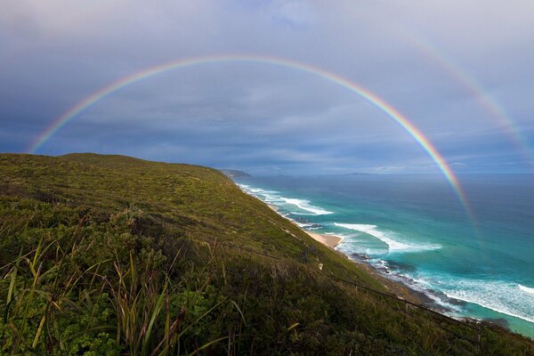 Rainbow in the distance of the seashore