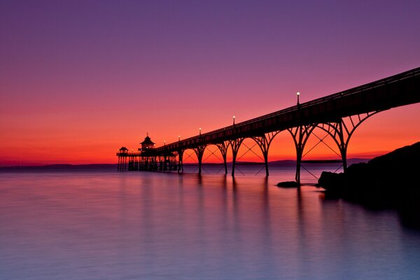 Evening sky in the lights of the bridge