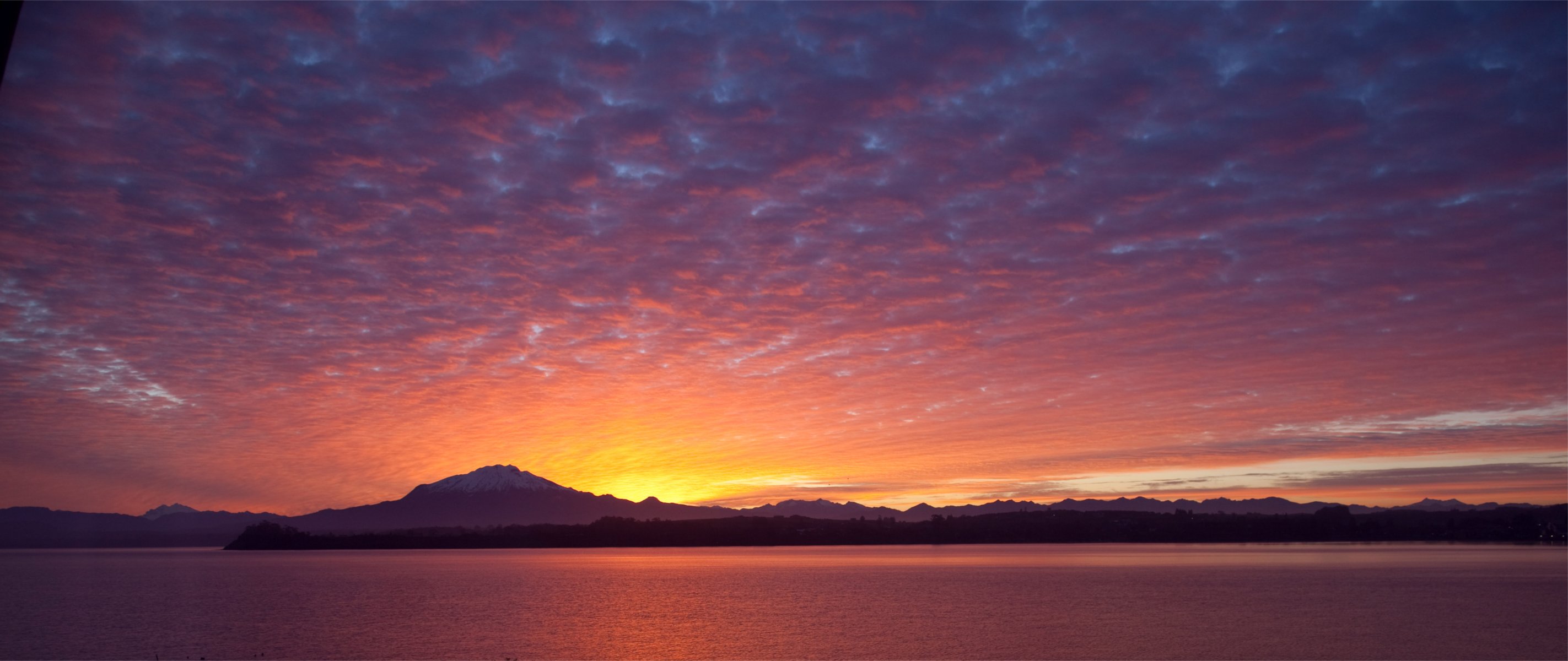 chile puerto varras puerto varas night sunset sky clouds lake mountain tree beach away