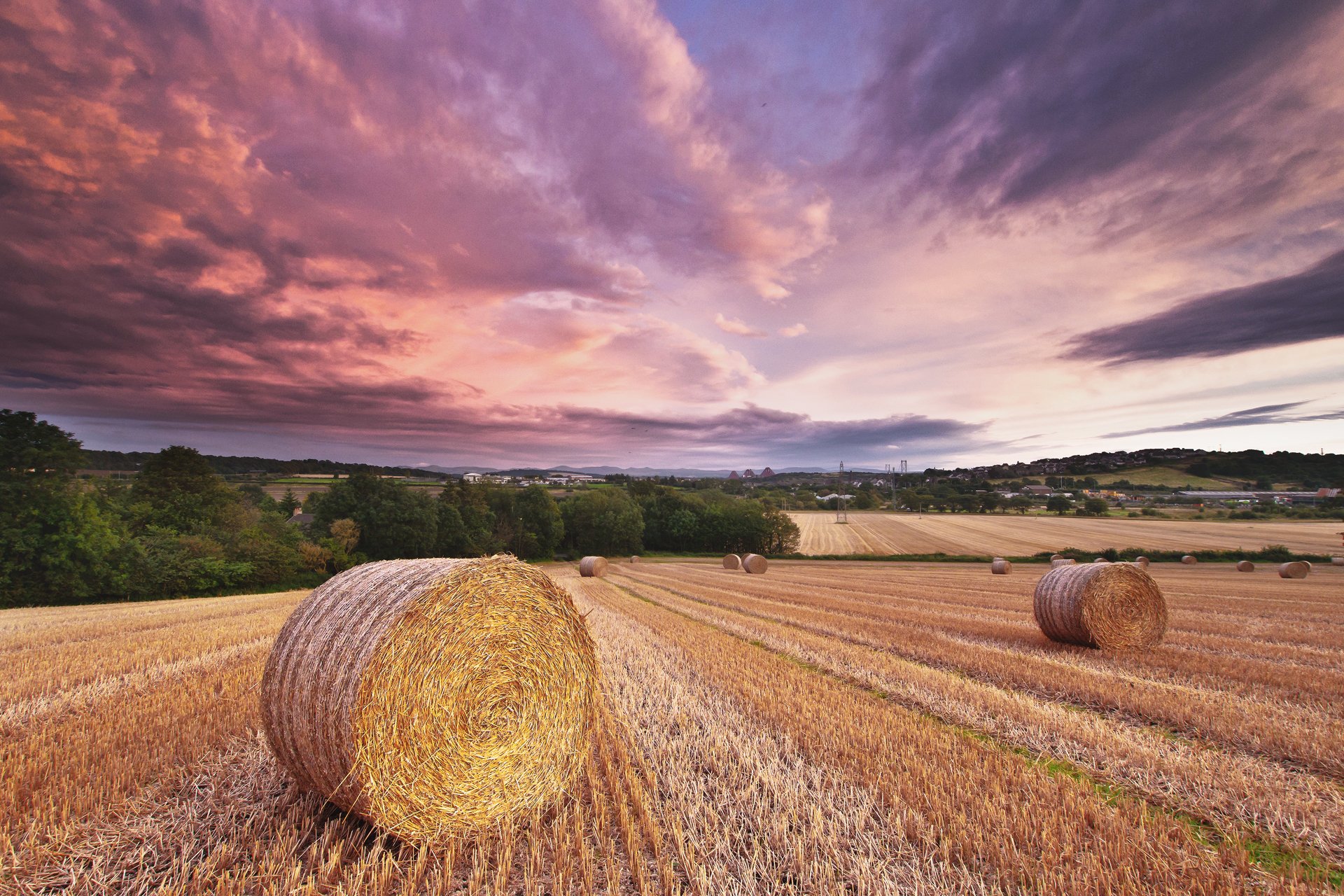 ummer the field rolls hay straw sky clouds night