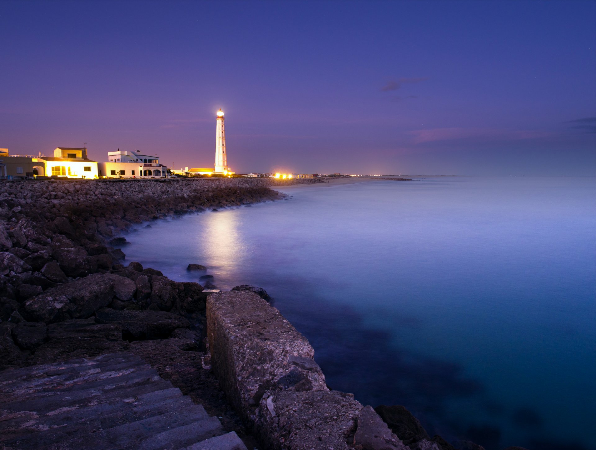 ea ocean beach stones a step blue purple night lighthouse light