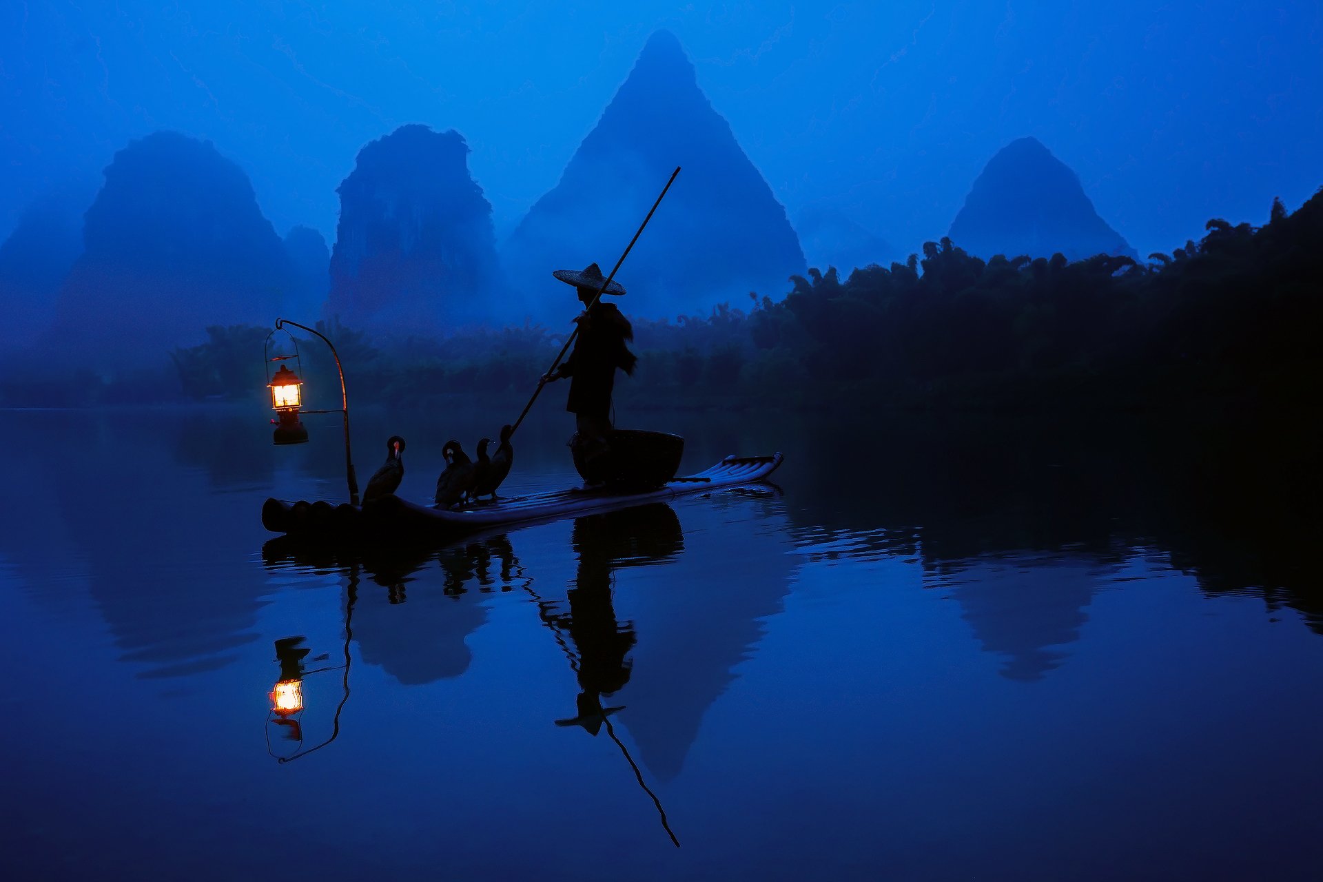 china morning fisherman boat lantern light cormorants river water forest reflection