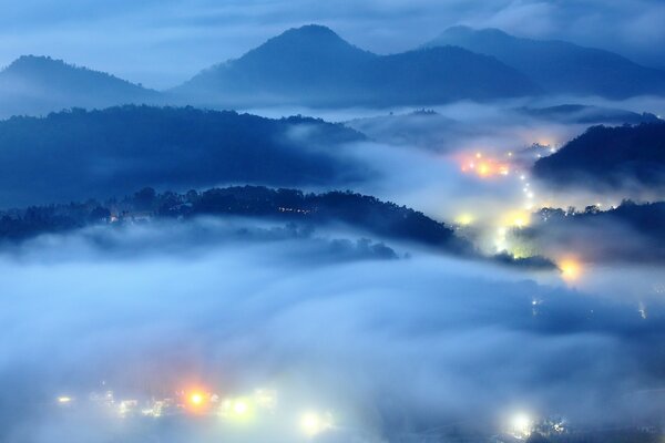 Taman over the evening city and lights