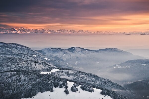 Winter landscape of forests and mountains