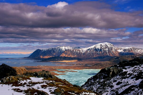 Calm sea at the foot of the mountains