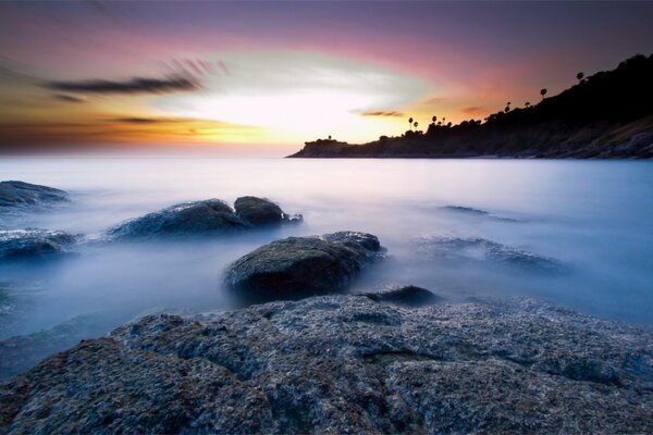 Rocky seashore at sunset