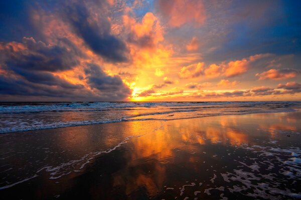 The fiery sun on the horizon of the sea