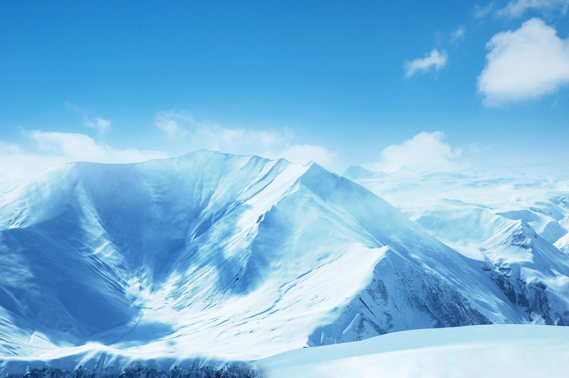 mountains slope snow-covered landscape blue sky cloud