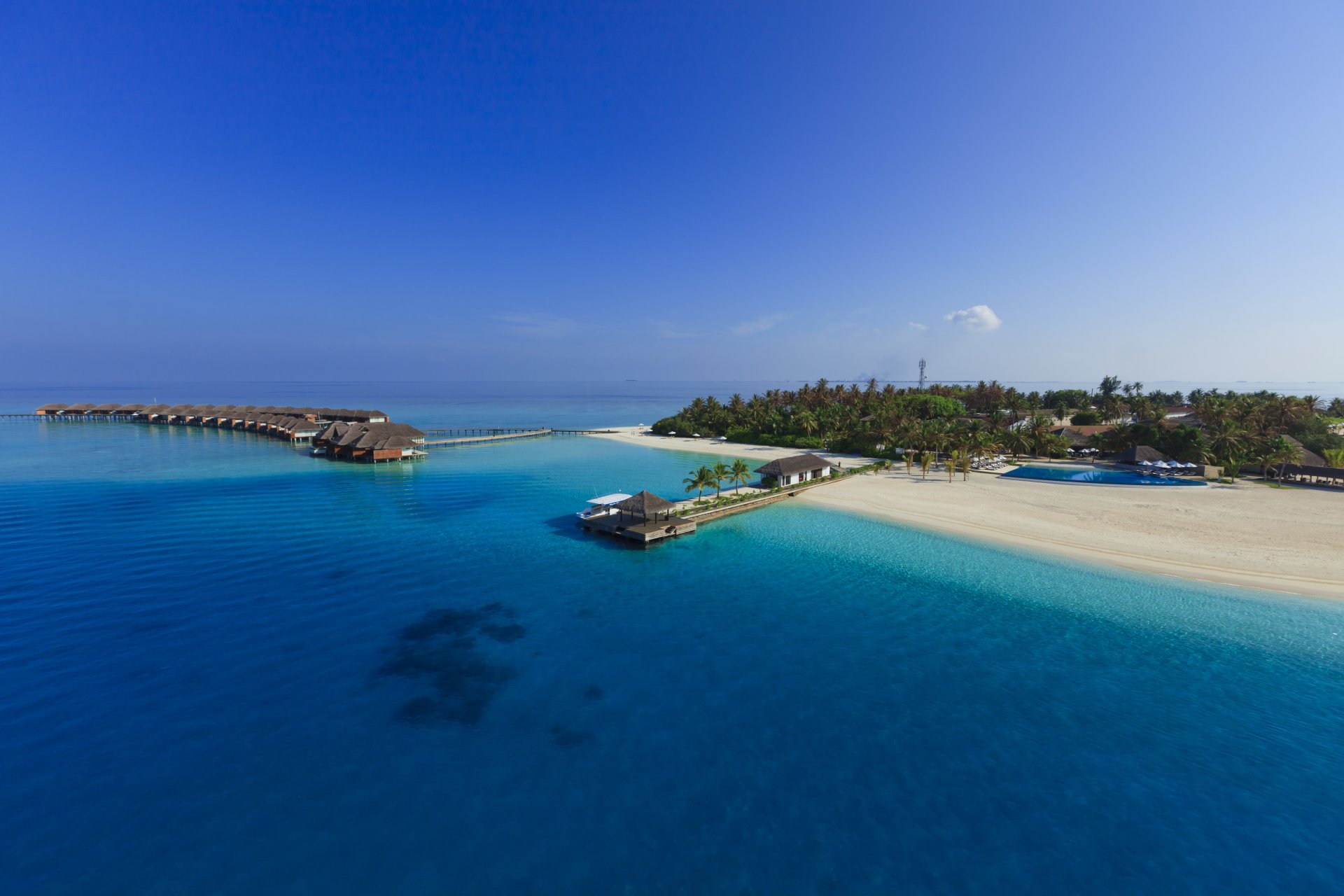 bungalow sur pilotis maldives île paradisiaque eau bleue