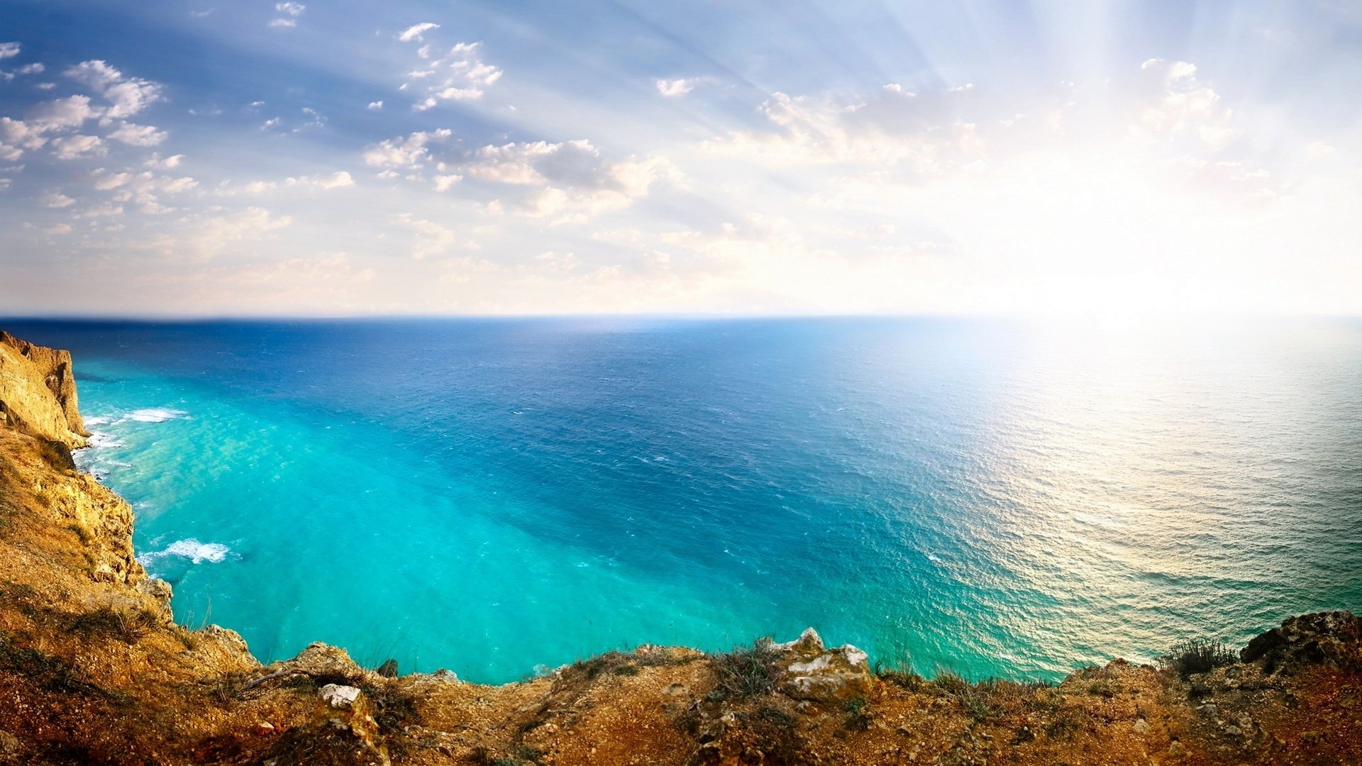 paysage mer océan roches soleil ciel nuages nature