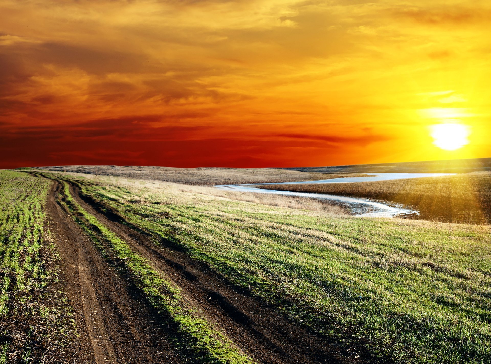 unset road road sunset sun colorful sky clouds horizon