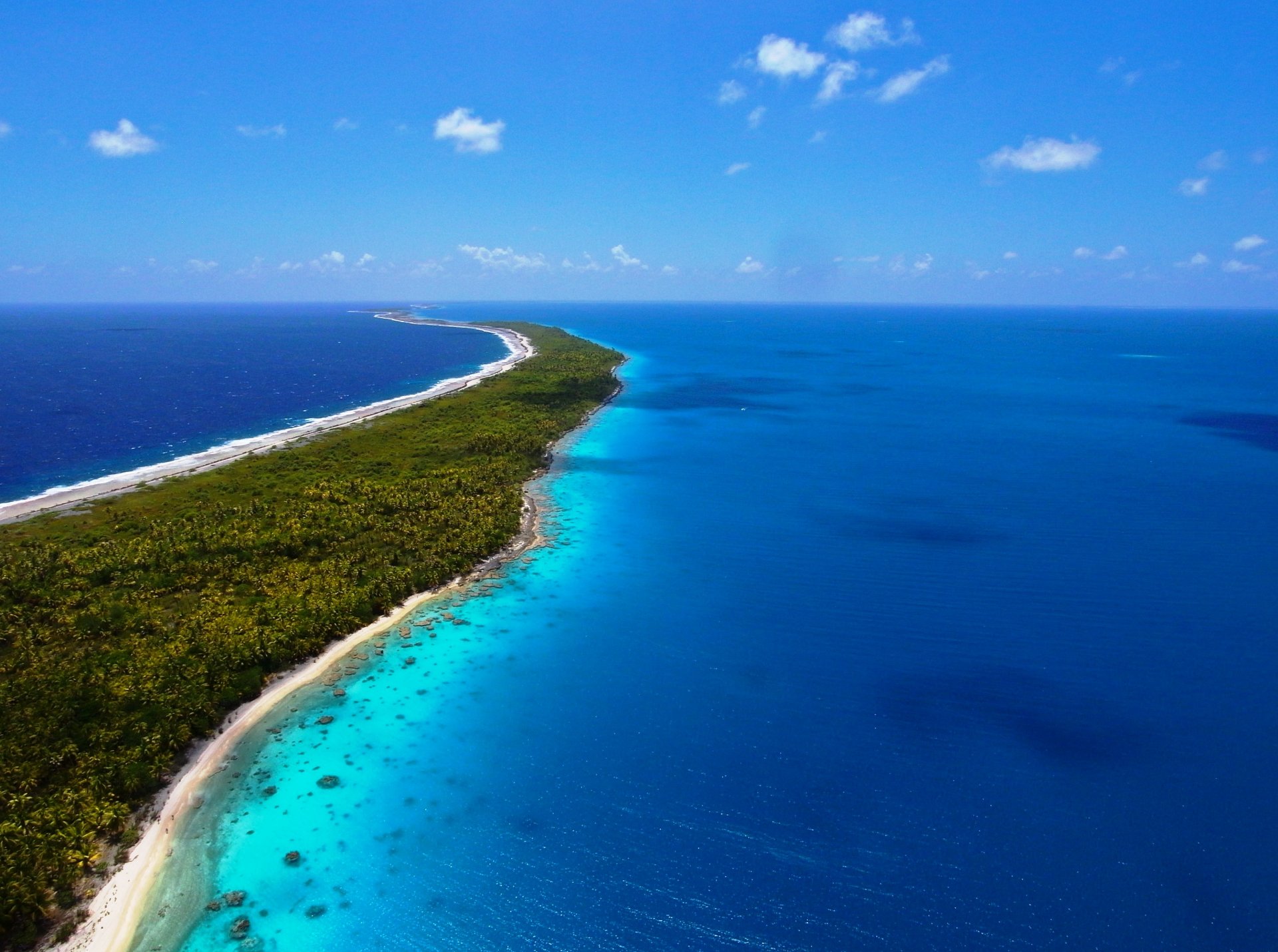 nature landscape ocean sea island land resort vacation beauty sky clouds blue blue