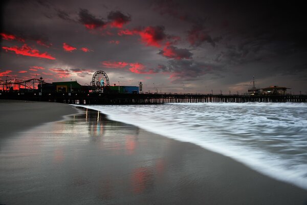 Beach on the background of a crimson sunset