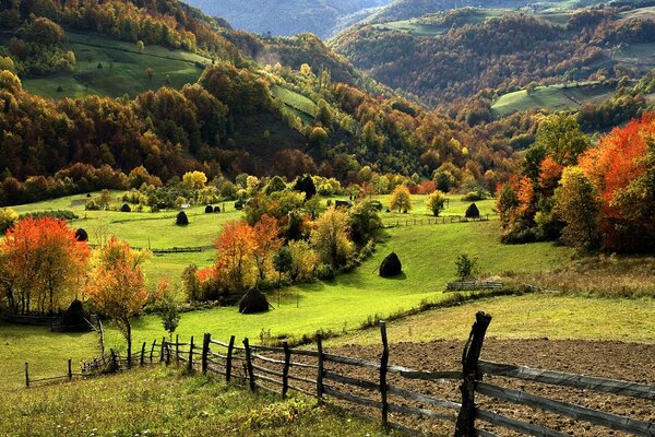 Village fence in autumn in the mountains