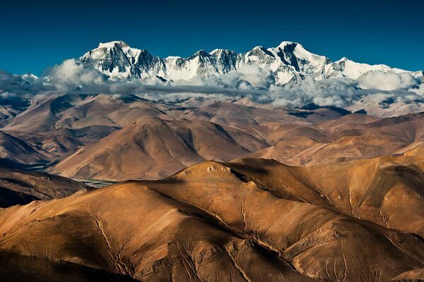 Tibetan mountains enveloped in clouds