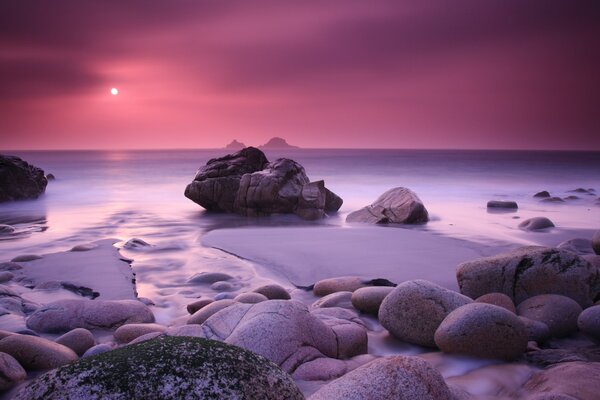 Sea big stones at sunset