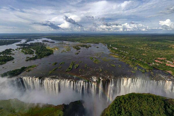 Victoria falls in Africa with a rainbow