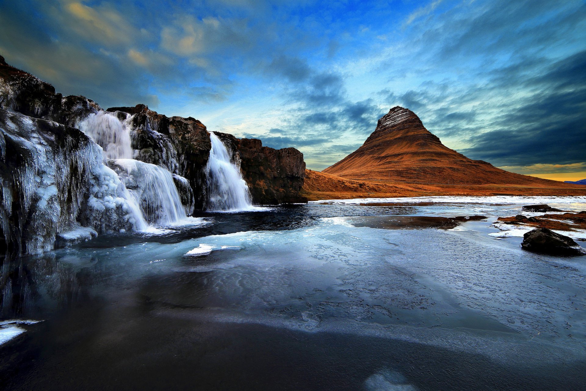 iceland kirkjufell mountain volcano rock waterfall sky