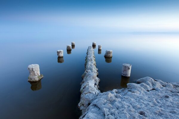 Magic pillars from the water surface in winter