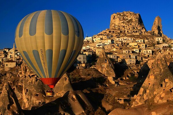 Balloon over the city in the mountains