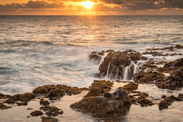 Beautiful bay at sunset, sunset and magic bay, transparent water of a beautiful bay, bay and sunset on the shore