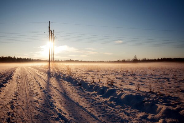 Winter road under the sun